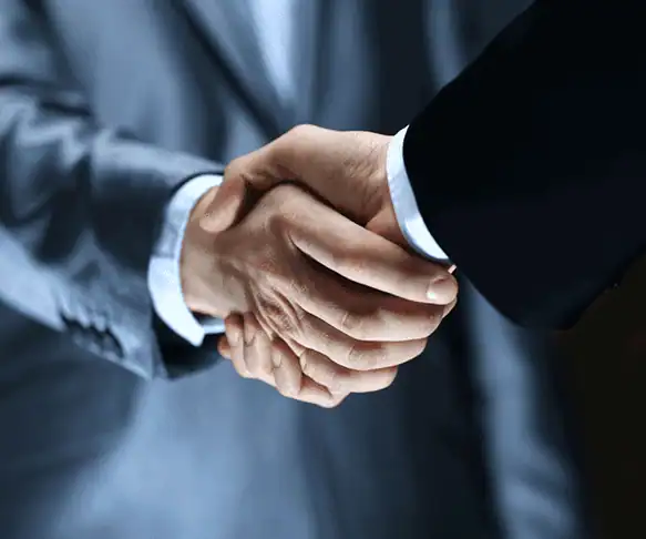 Handshake image representing partnership or agreement.