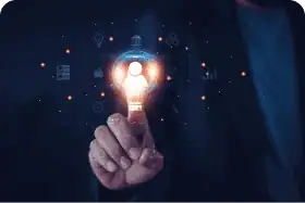 Une main, dont l'index est lumineux, est sur le point de toucher une ampoule lumineuse contenant une silhouette humaine. Auto
